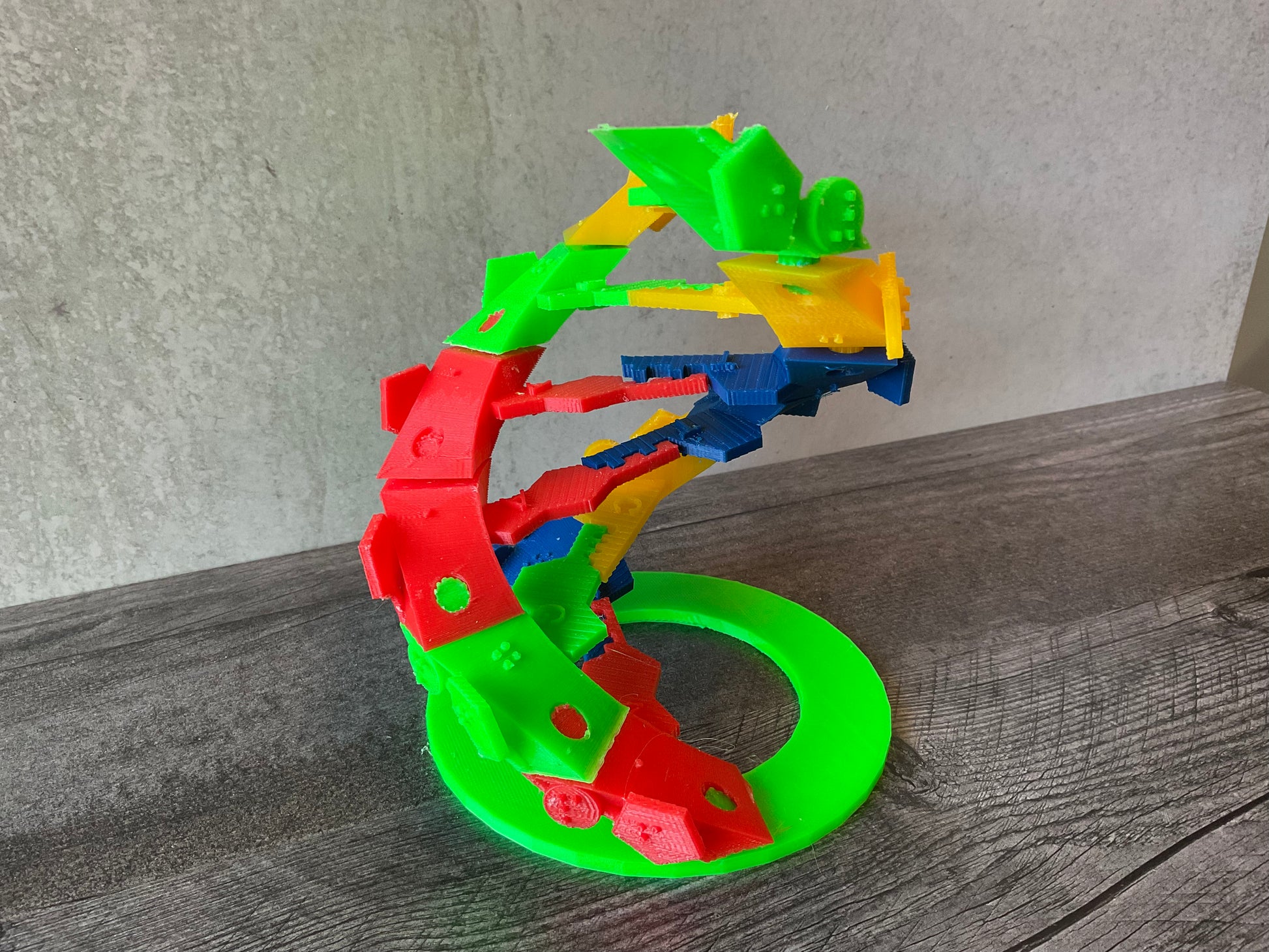 a closer shot of the DNA. You can see the letters A,G,A, A going up the rungs of one side. On the other side you can see a D for deoxyribose and a P for a phosphate making up the spine.