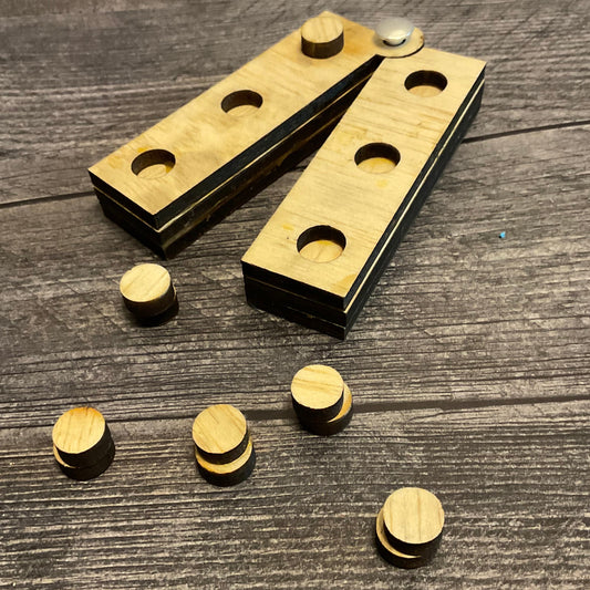 A braille swing cell laying flat. Swing cells can pivot to be straight across(showing braille cells left to right 3,2,1,4,5,6 like on a perkins) or swing closed to show them in 2 columns, 1,2,3 and then 4,5,6