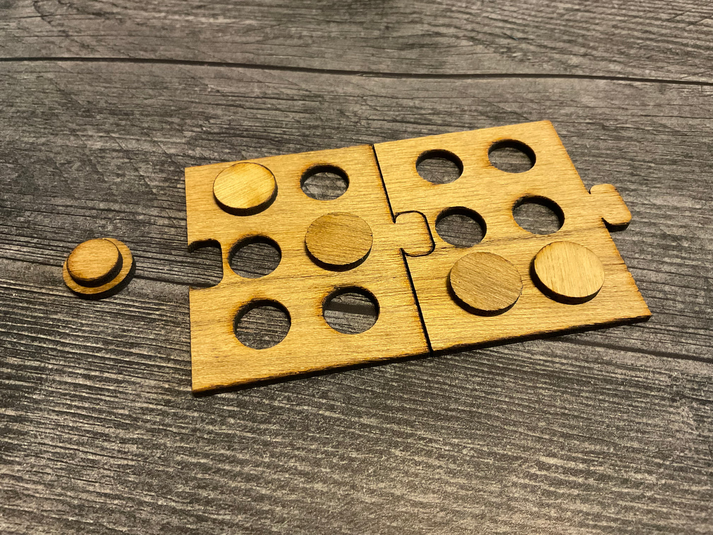 A close up on 2 puzzle pieces and a peg.