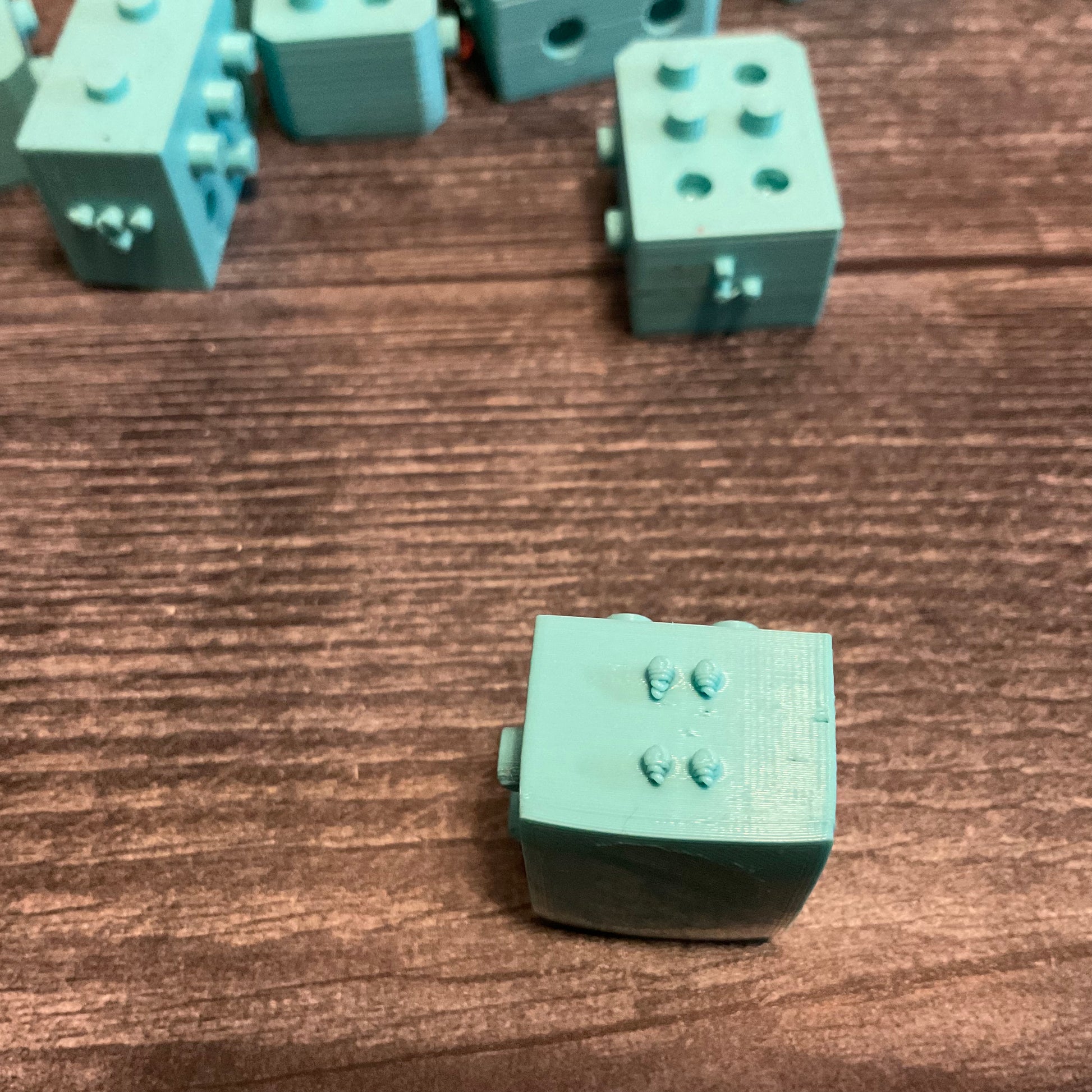 A close up on the braille on the front of a block.