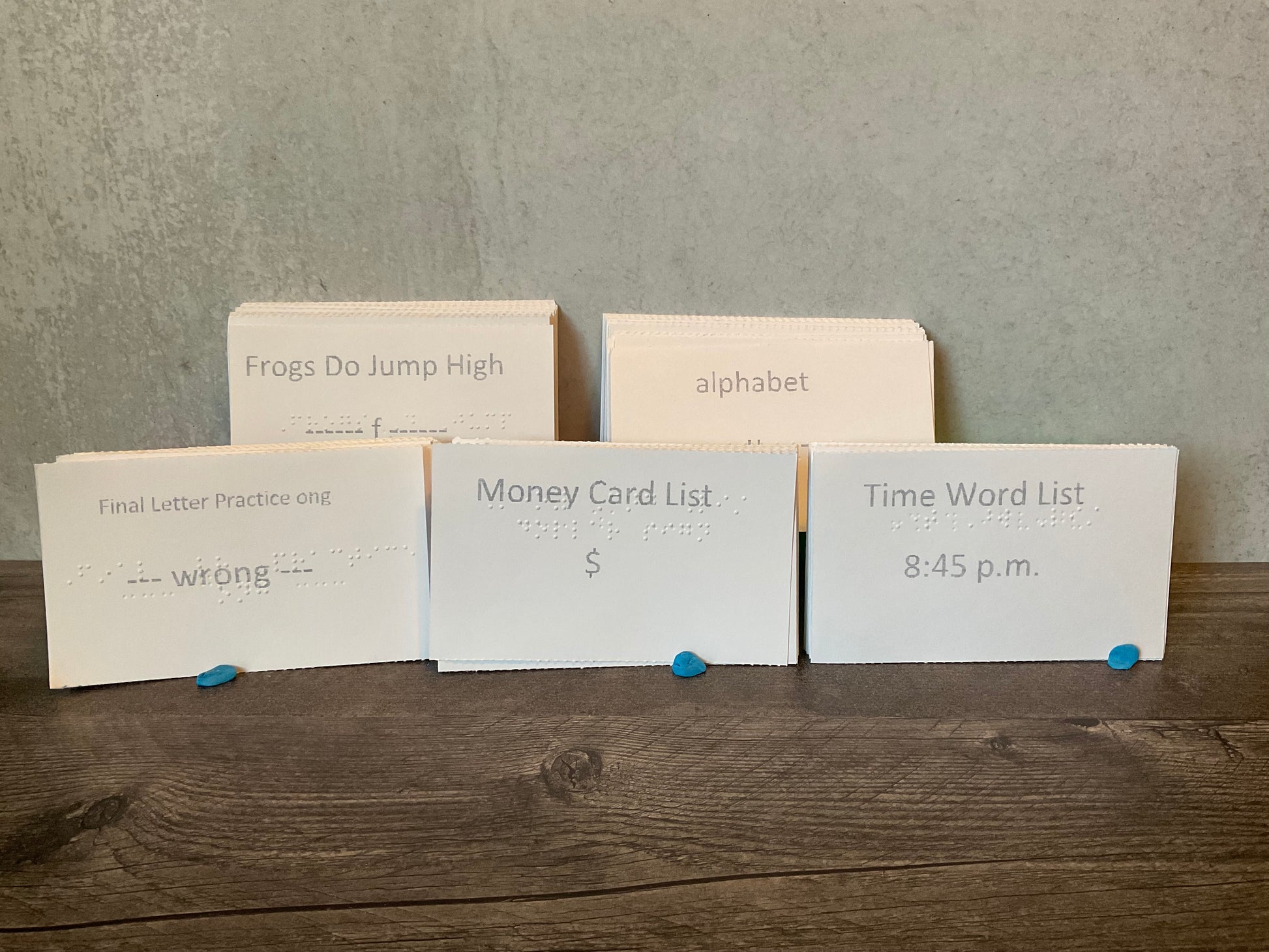 Braille cards with final letter contractions, the alphabet, the Frogs Do Jump High activity, a money list and a bunch of times to practice on. All are printed in interpoint with large print on the front.