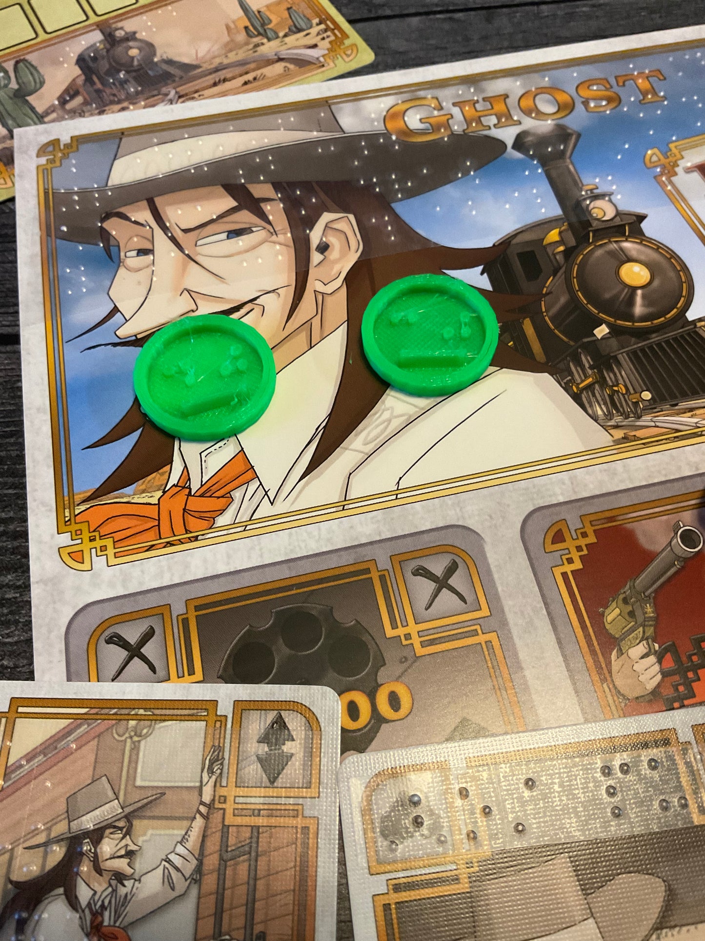A shot of the 3d printed bag replacement tokens sitting on the player mat. These are 3d printed because the original pieces were too small for even 2 braille cells.