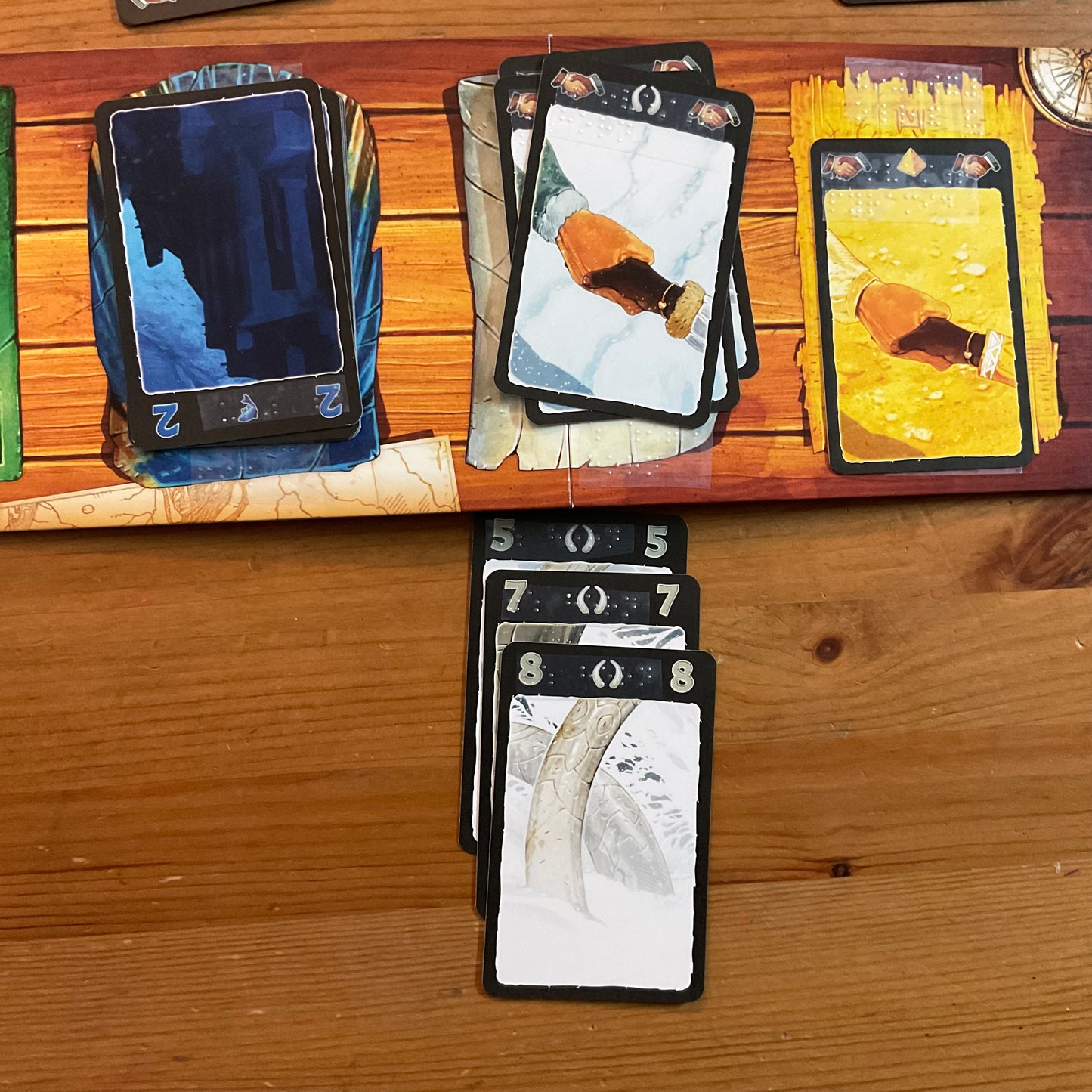 A shot of a white expedition. The cards and the board have braille on them