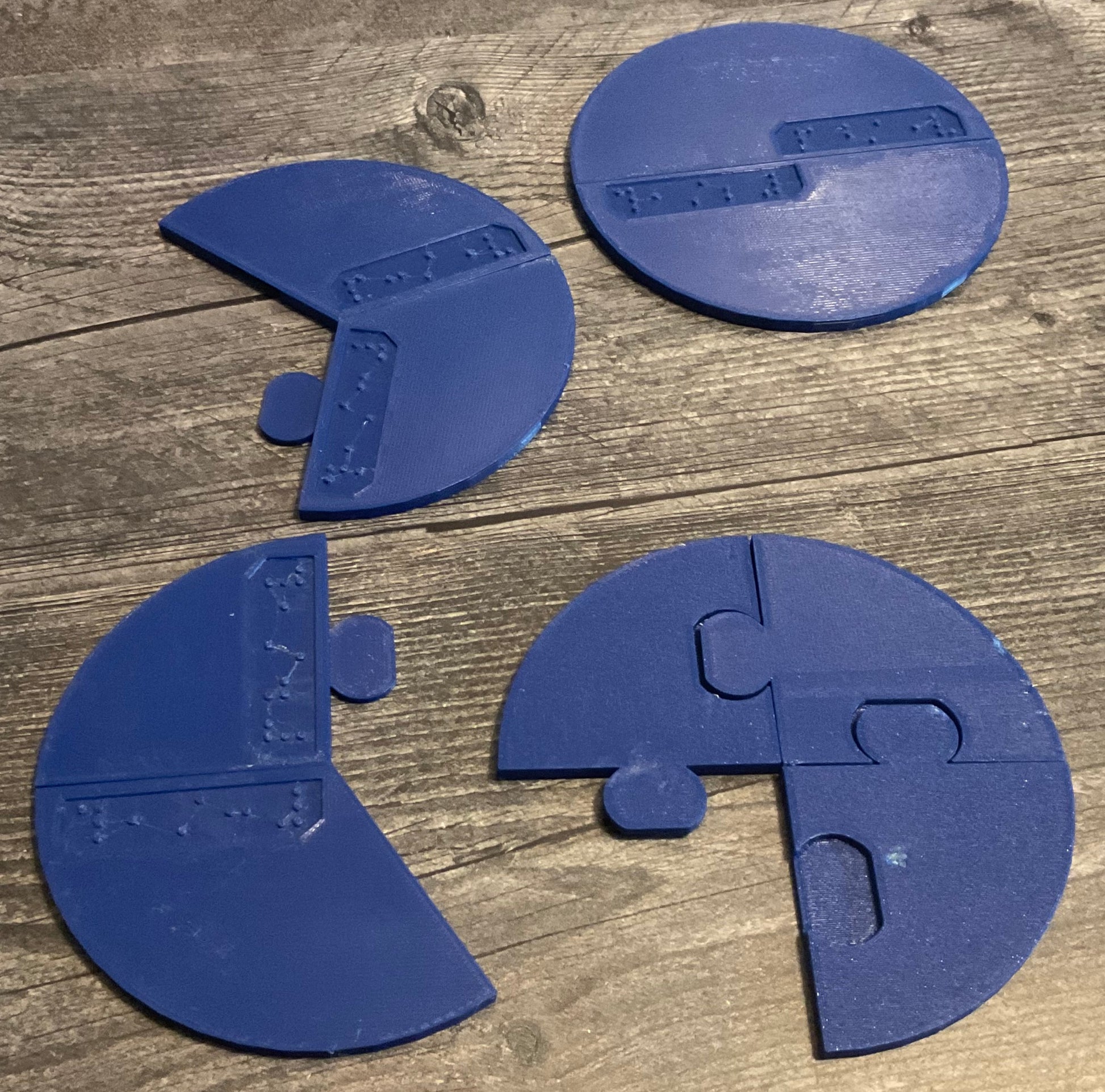 Some of the pieces from the 1/2, 1/3, 1/4 set showing how they look on the bottom with puzzle pieces and how they can all fit together.