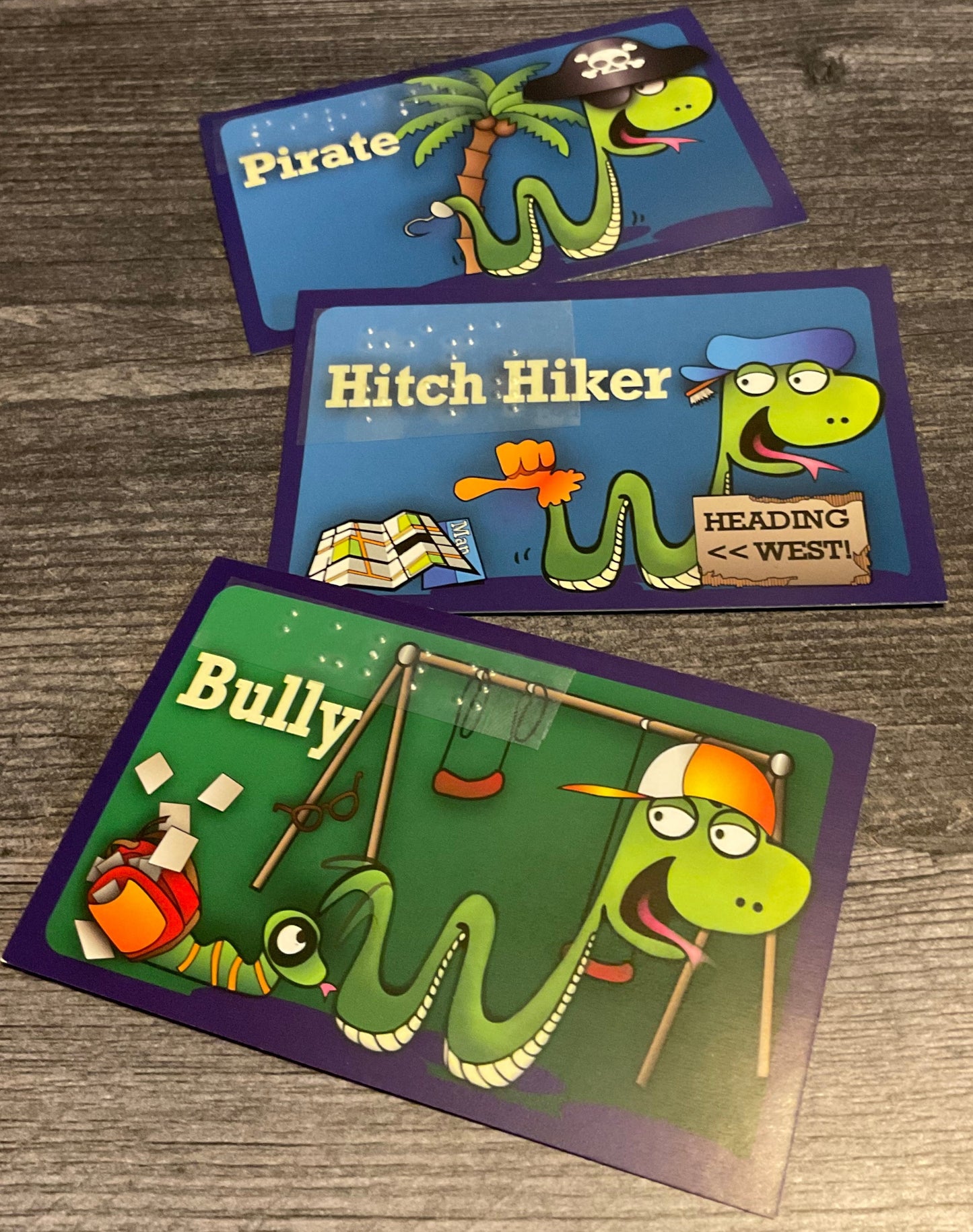 Customer cards for a pirate, a hitch hiker and a bully. All have transparent braille on them