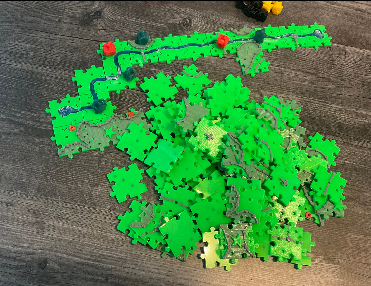 An overhead view of the pile of replacement tiles and the river.