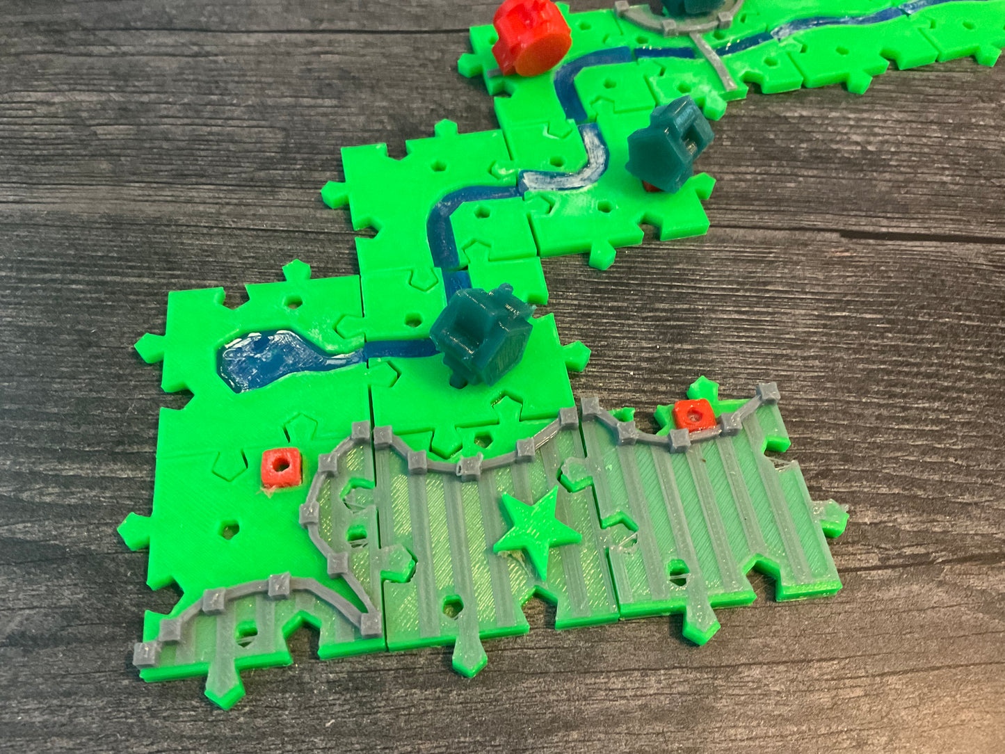 A close up of the start of the river. The big star represents double points for that city square. The red squares are the garden tiles for the abbot.