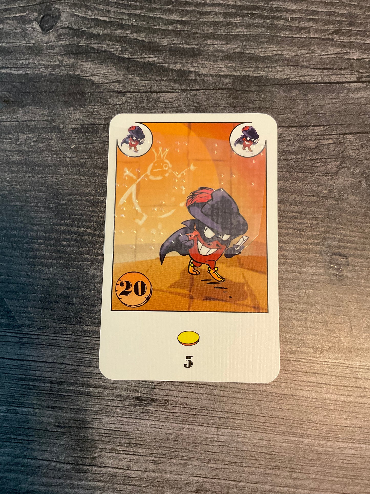 One of the cards. The card says there are 20 copies, 5 copies nets you 1 coin.