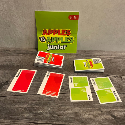 Apples to apple cards with QR code stickers on the back. The QR codes lead to the full text of the cards.