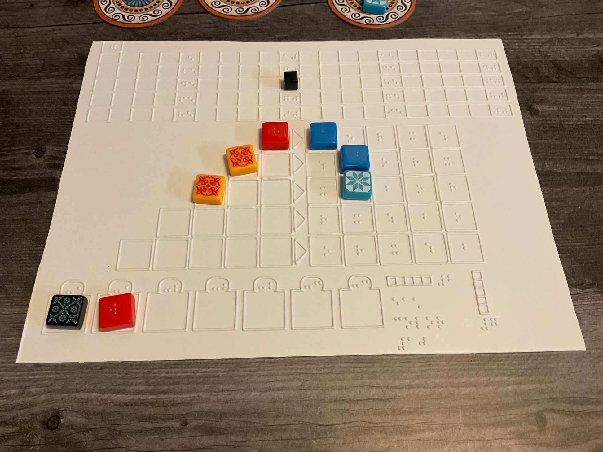 A close up on the tactile replacement boards with a few tiles on them.