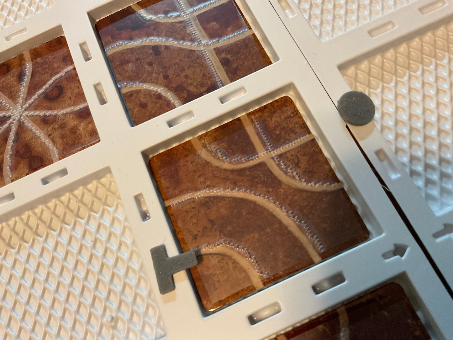 The board with the 'T' 3d shape and the 'O' 3d shape on the same tile