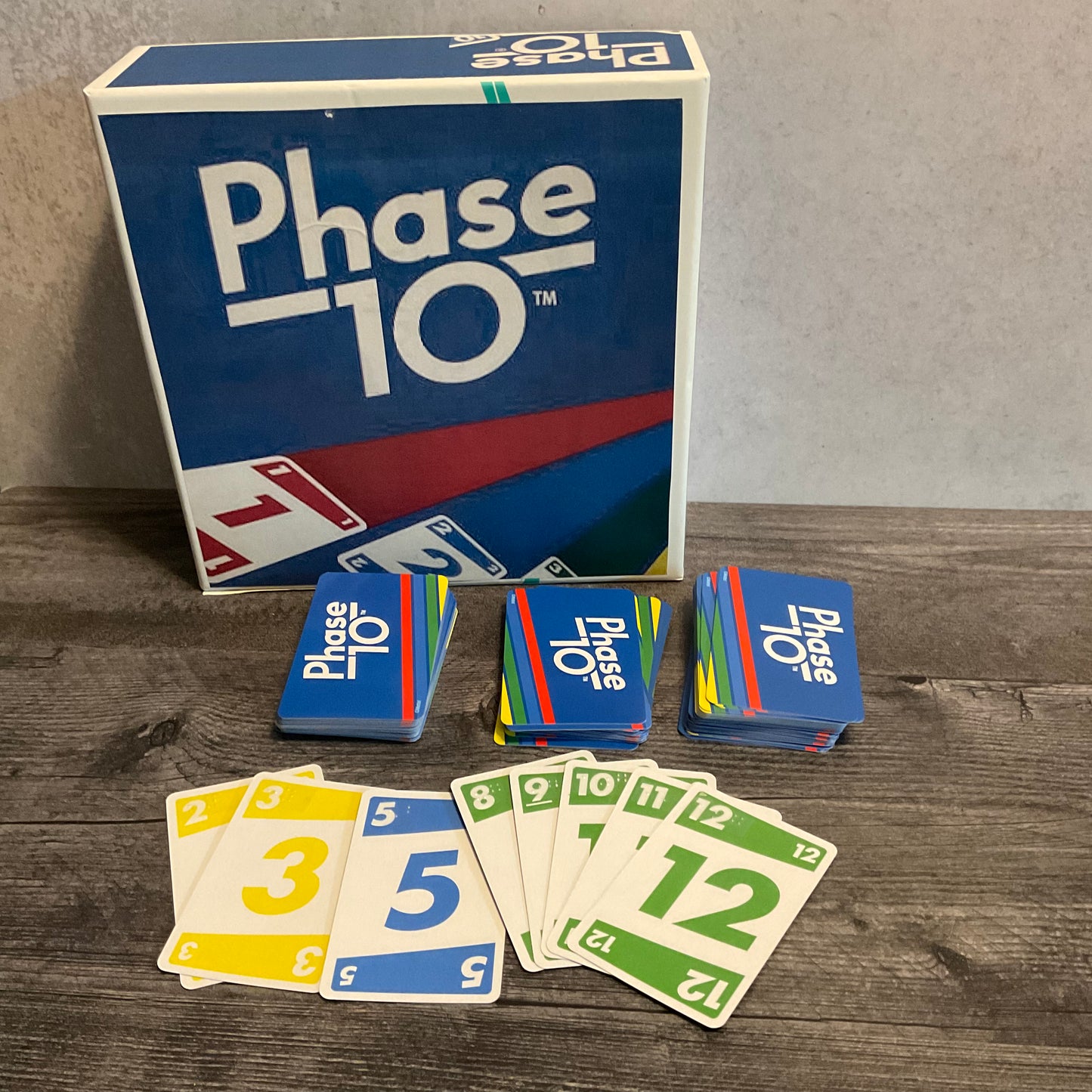 A picture of the cards. Transparent braille describing the number and the color is on all of the cards.