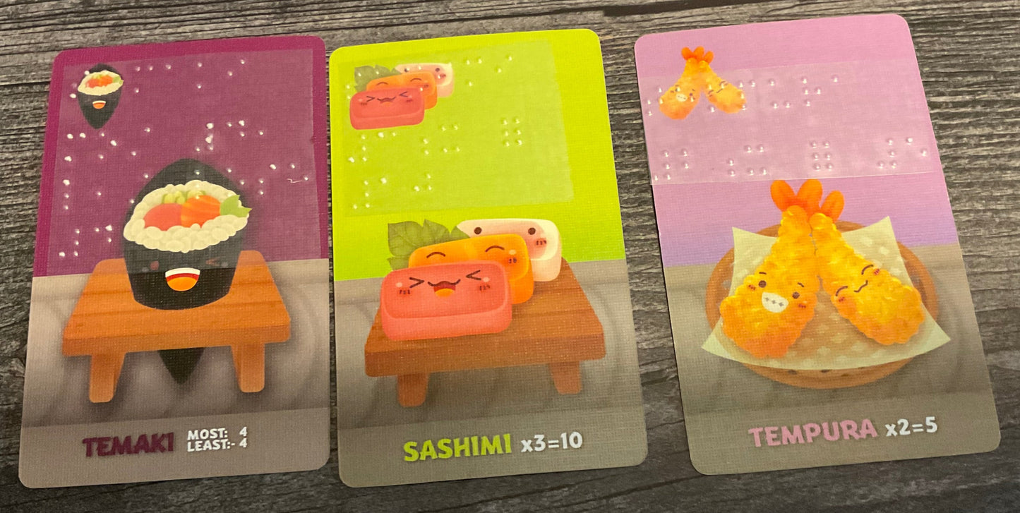 Tamaki, Sashimi and tempura cards laid out. All 3 have braille on them.