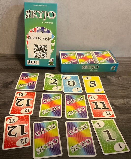 The box with a 3x4 grid of cards set up in front of it. All the cards have transparent braille on them.