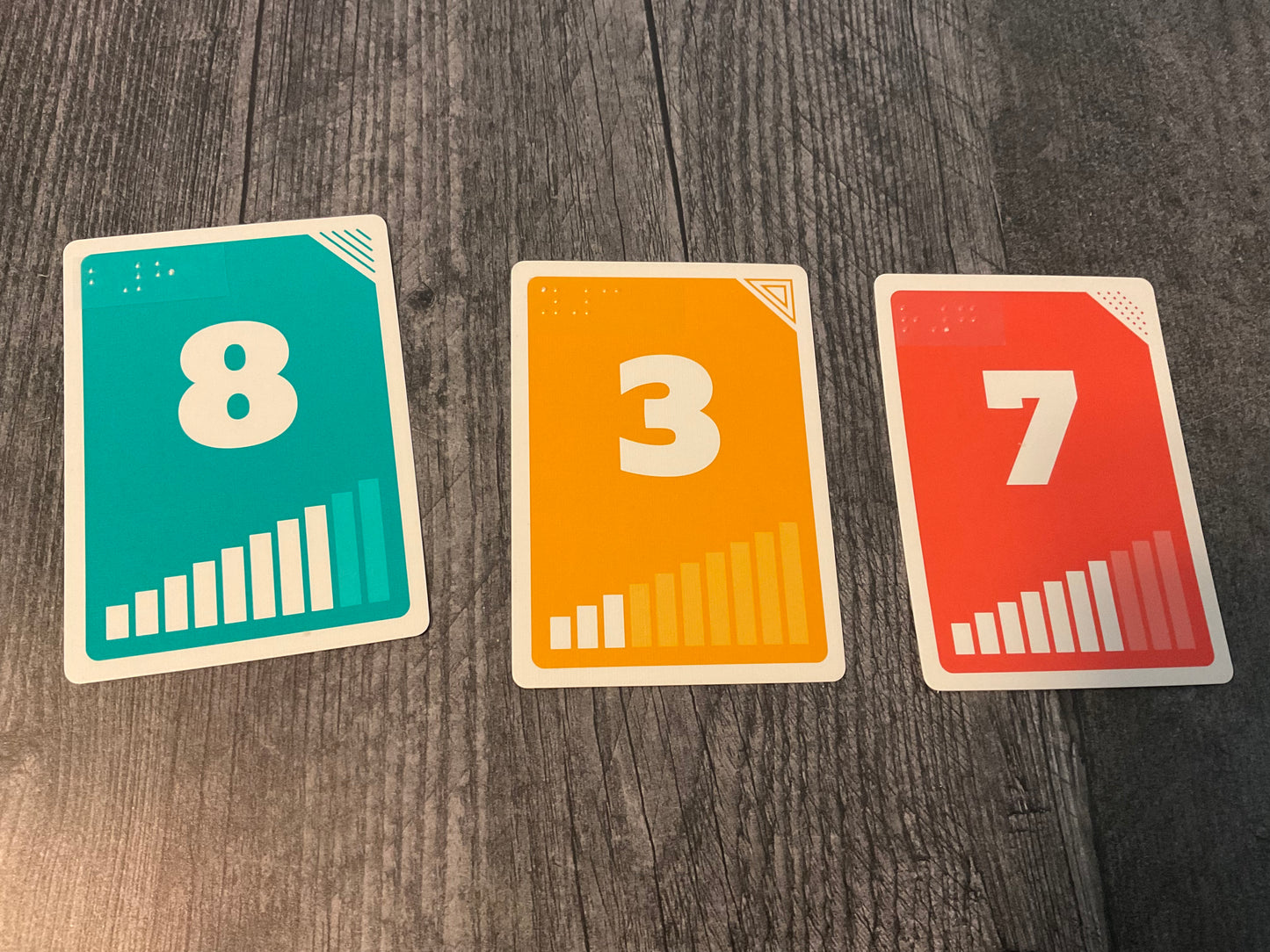 The different number cards are shown with transparent braille