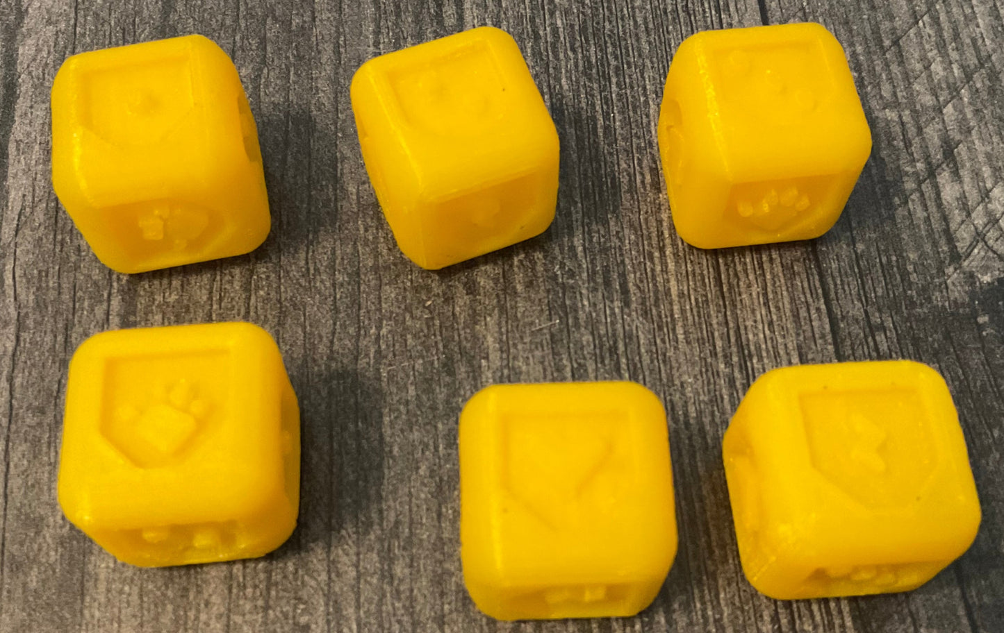 3d printed braille dice with different shapes for the different sides.