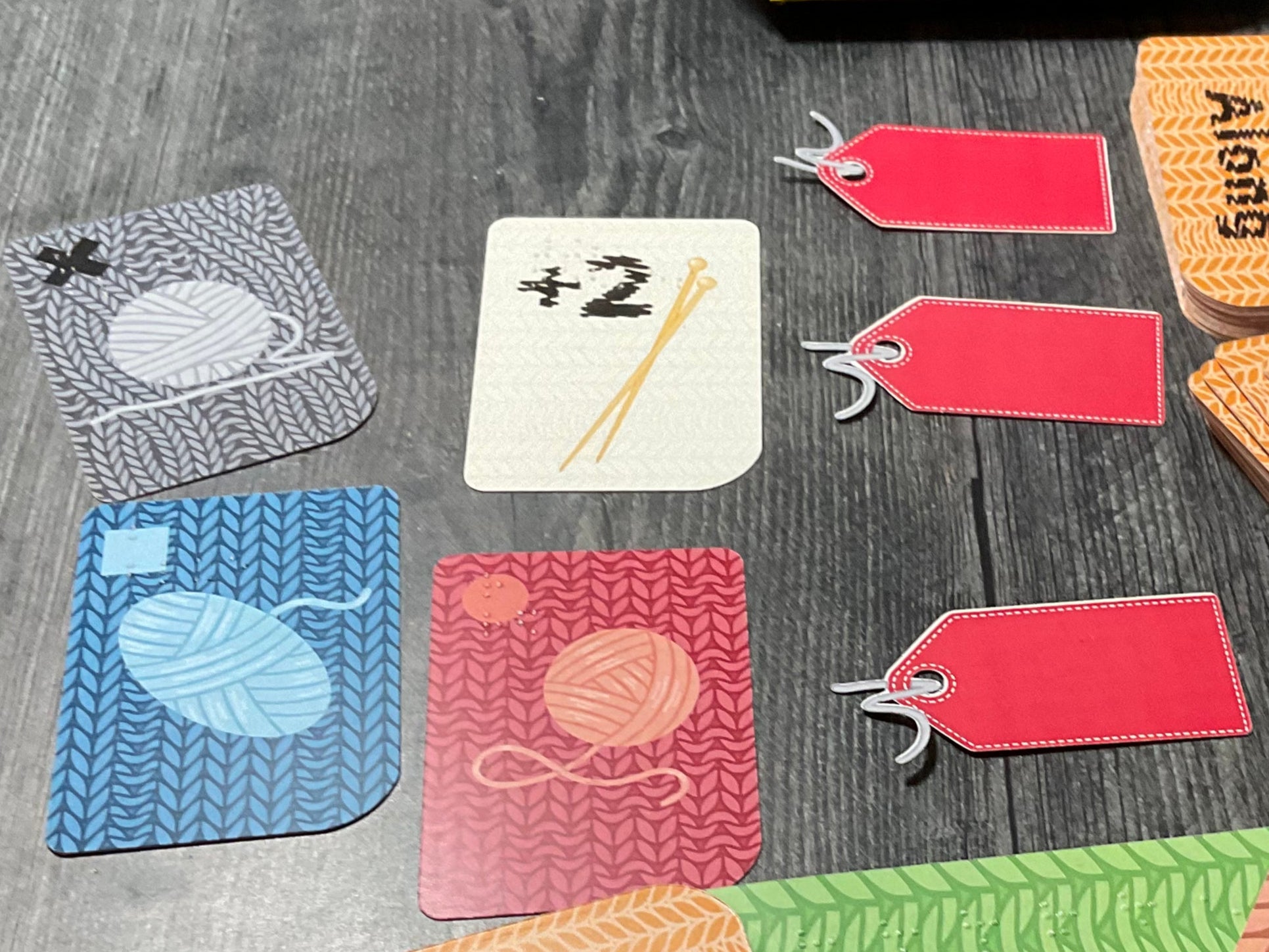 A picture of the cards laid out into three different lots. Two lots have 2 cards in them and one is empty.