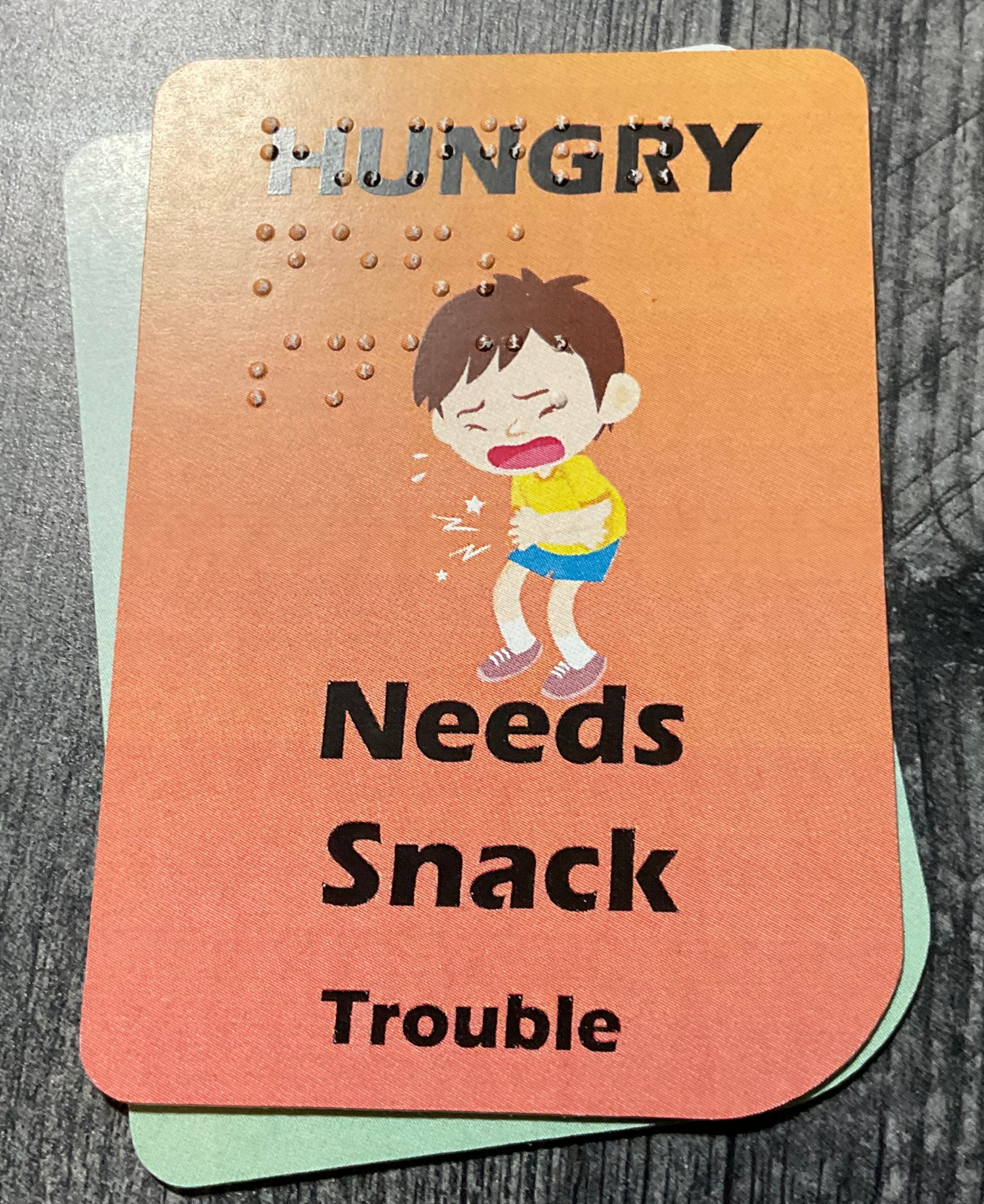 A close up of the hungry trouble card.