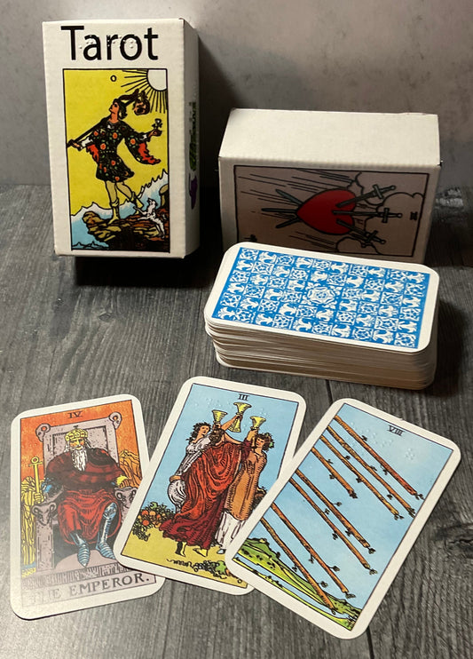 The box with a few of the cards laid out in front.