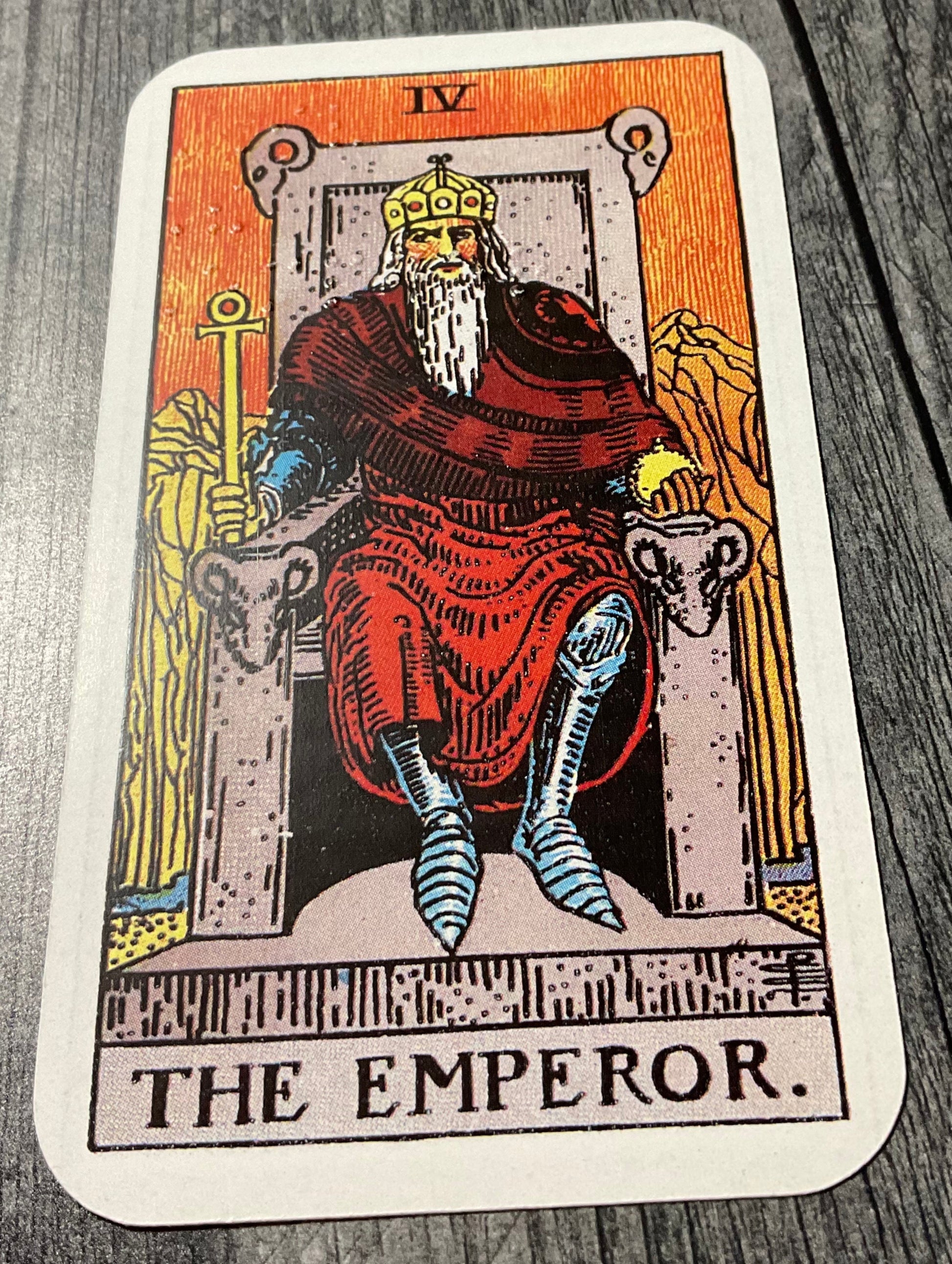 A close up of the brailled emperor card