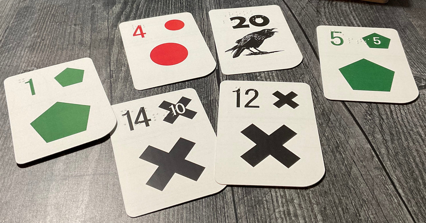 A picture of some of the rook cards including the rook itself, a black 14 and more.