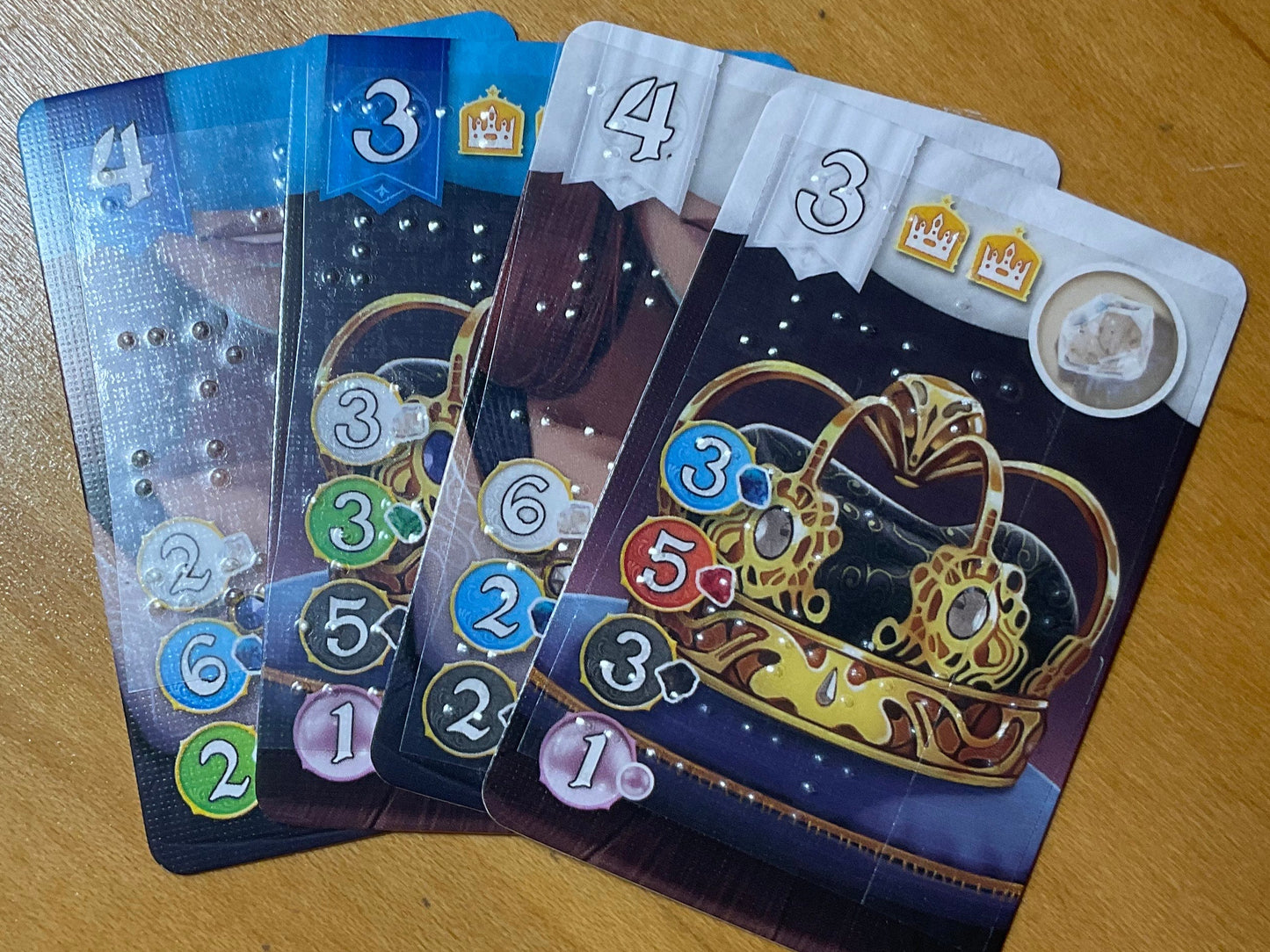 Close up on gem cards with transparent braille on them