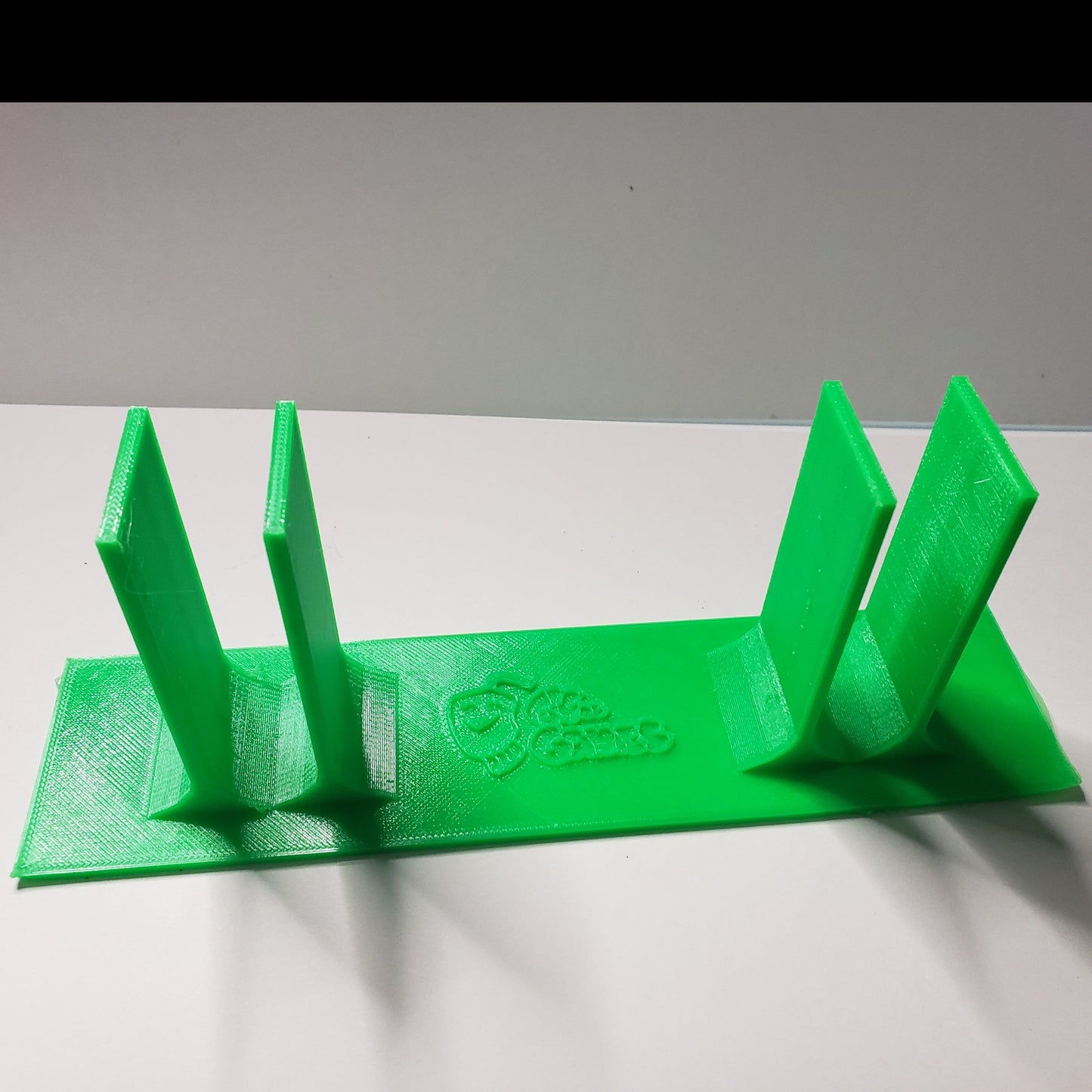 A 3d plastic device that fits under the smart Perkins brailler to keep fingers positioned correctly on the keys.