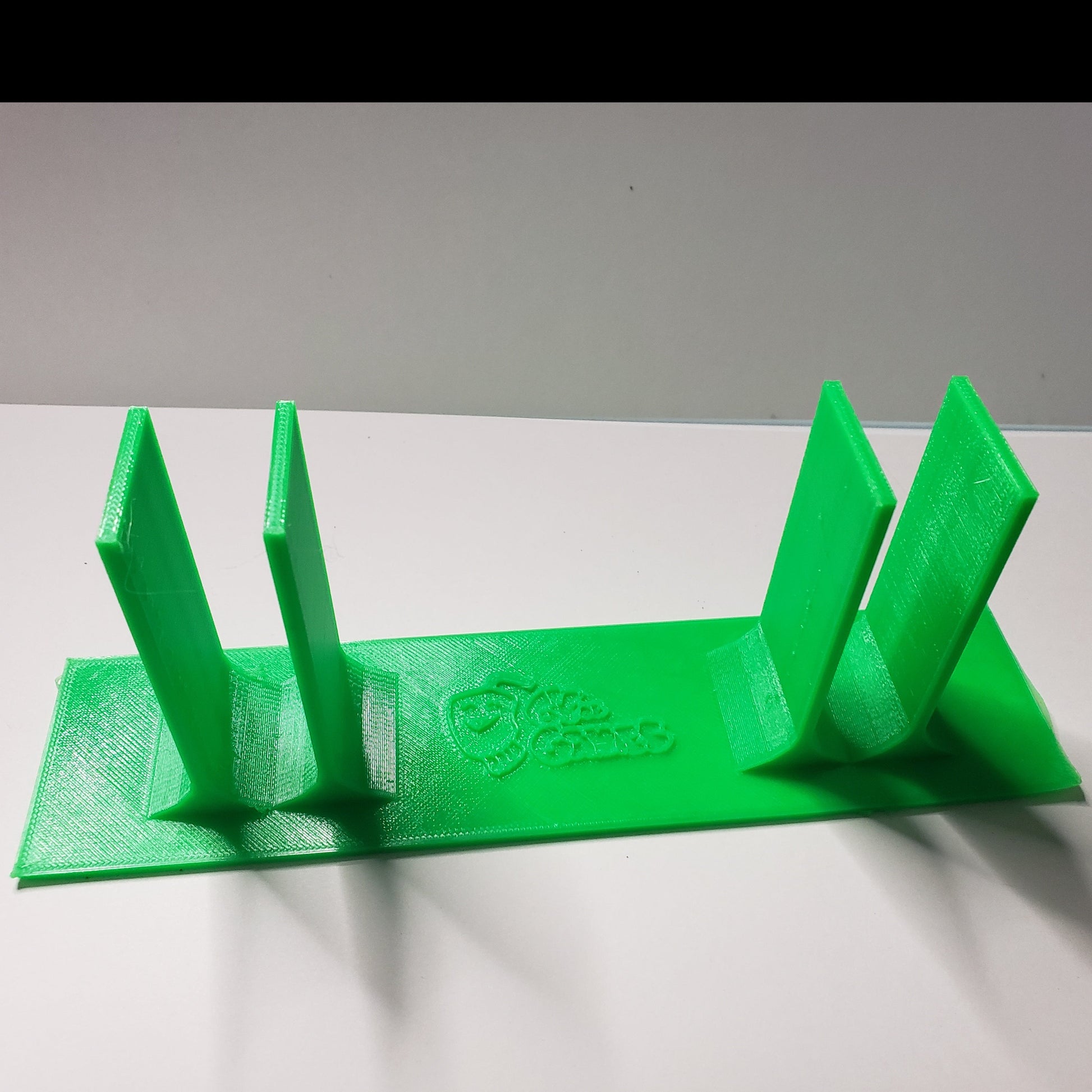 A 3d plastic device that fits under the smart Perkins brailler to keep fingers positioned correctly on the keys.