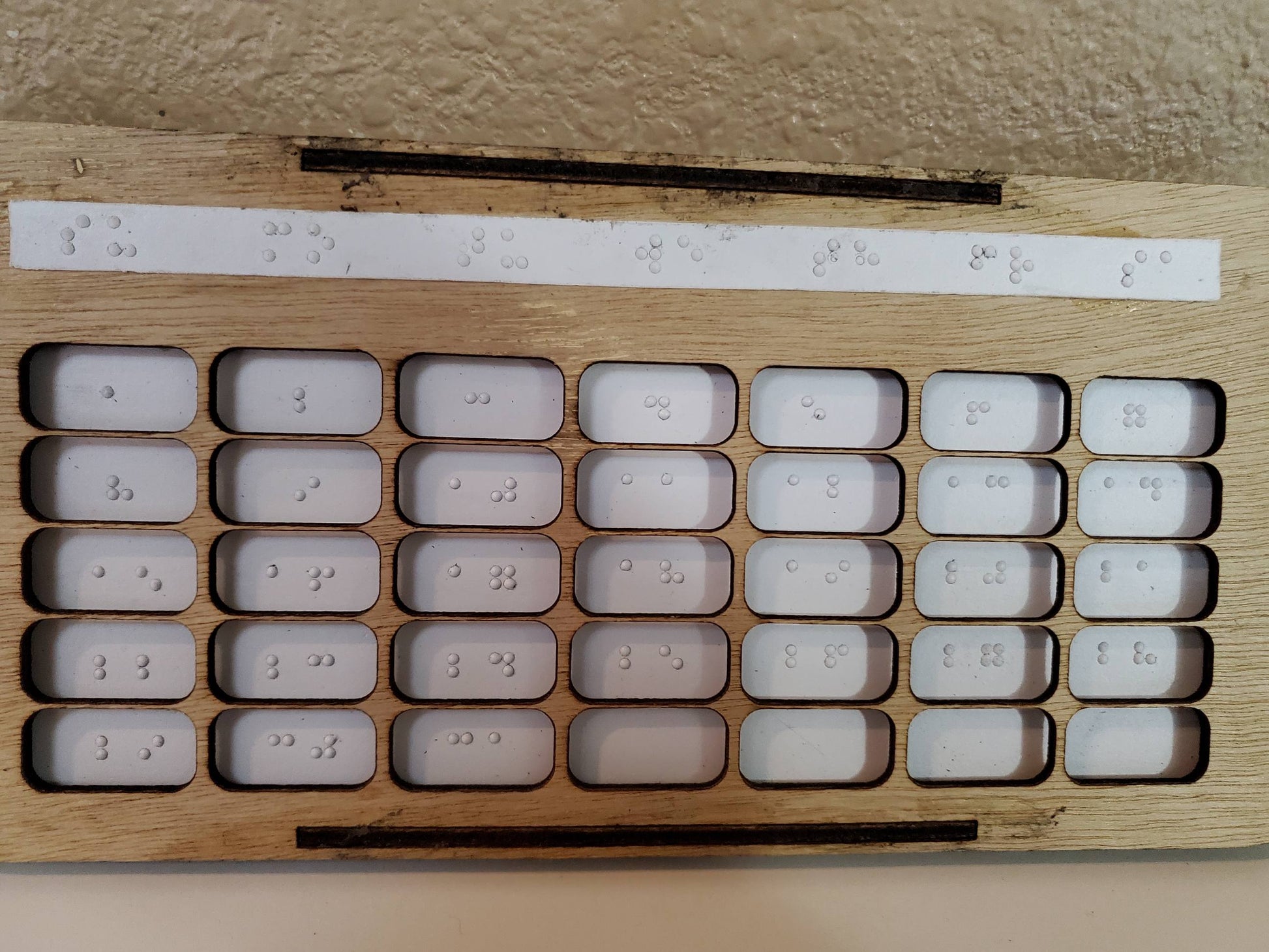 A close up of the braille calendar is shown.