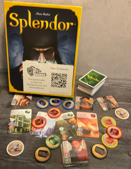 Shot of the Splendor game. Tokens with braille on them, the noble cards with transparent braille on them, and the game cards also have transparent braille on them.