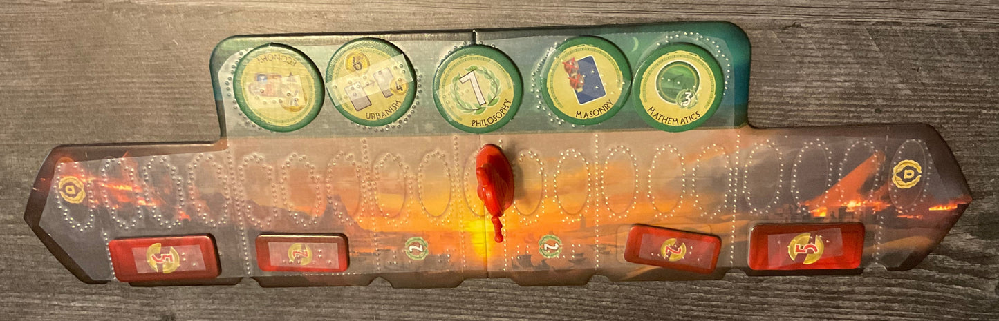 The military track with a transparent overlay on it that has circles for all of the spots on the board. Tokens are on the appropriate squares, all with transparent braille on them.