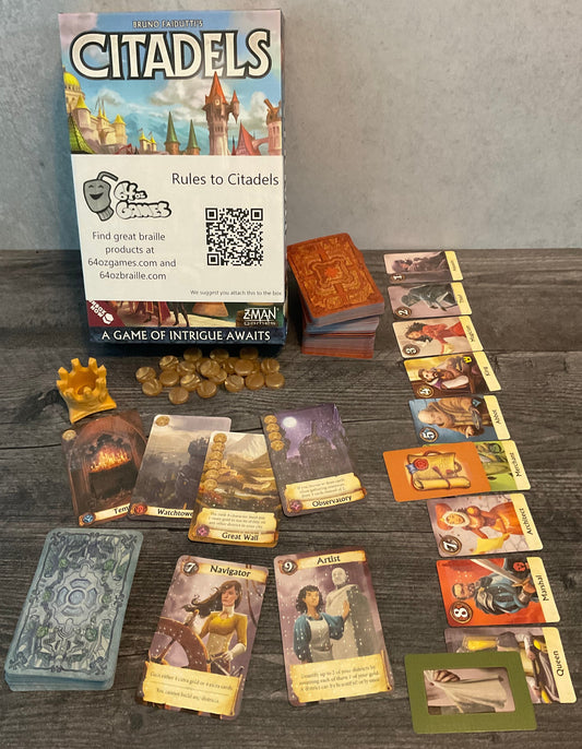 The box of Citadels along with all the different types of cards. Cards have the gameplay information on them in transparent braille.