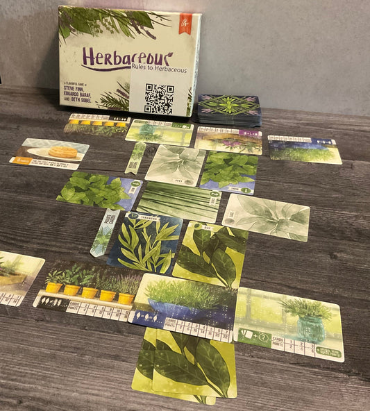 The game sort of laid out with the market in the middle and the player gardens towards the front and the back. Every card has transparent braille on it showing it's function.