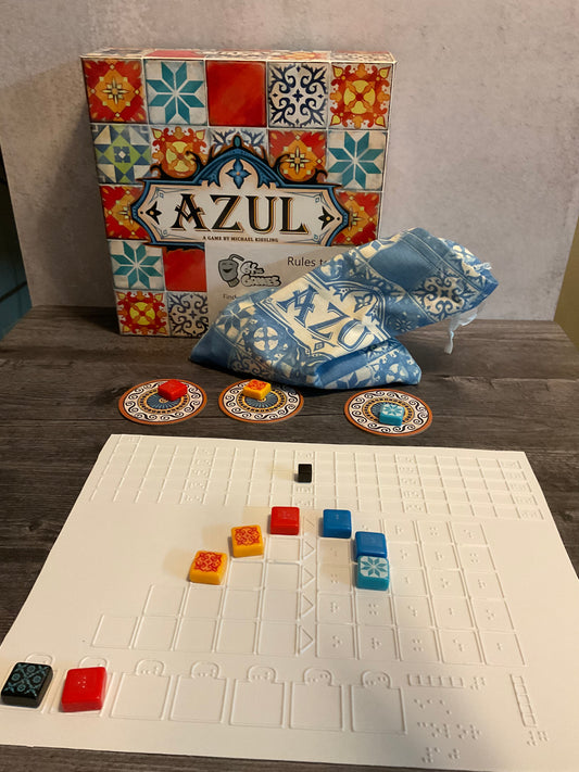 A shot of the Azul box with one of the thermoformed replacement boards with tiles on it. Each tile has a transparent braille sticker on them.
