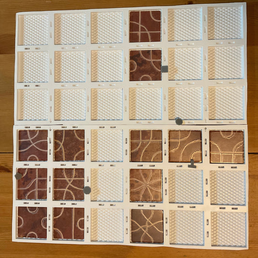 The thermoformed Tsuro replacement board setup . 3d printed pieces are in the slots along the board following the paths
