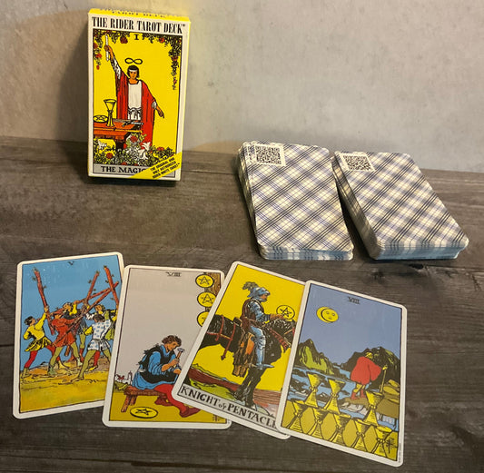 The tarot deck. 4 cards are laid out in front. The back of the cards have a QR code which links to the Wikipedia article on that particular card.