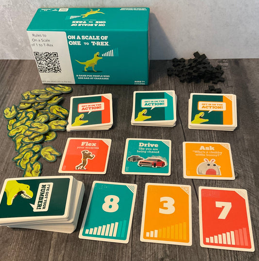 Scale of 1 to T-Rex game laid out. Replacement tokens for the bad tokens are shown and all the different decks are sorted.