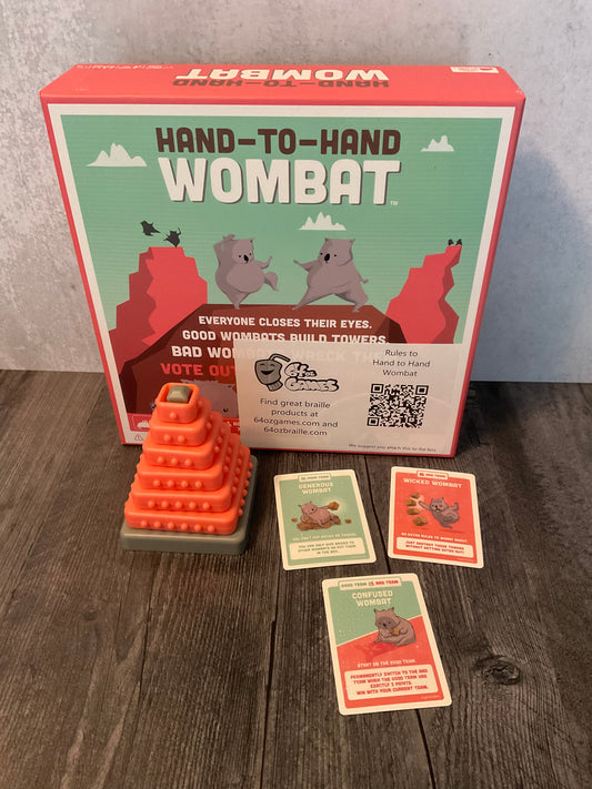 Hand to hand wombat with transparent braille on the cards