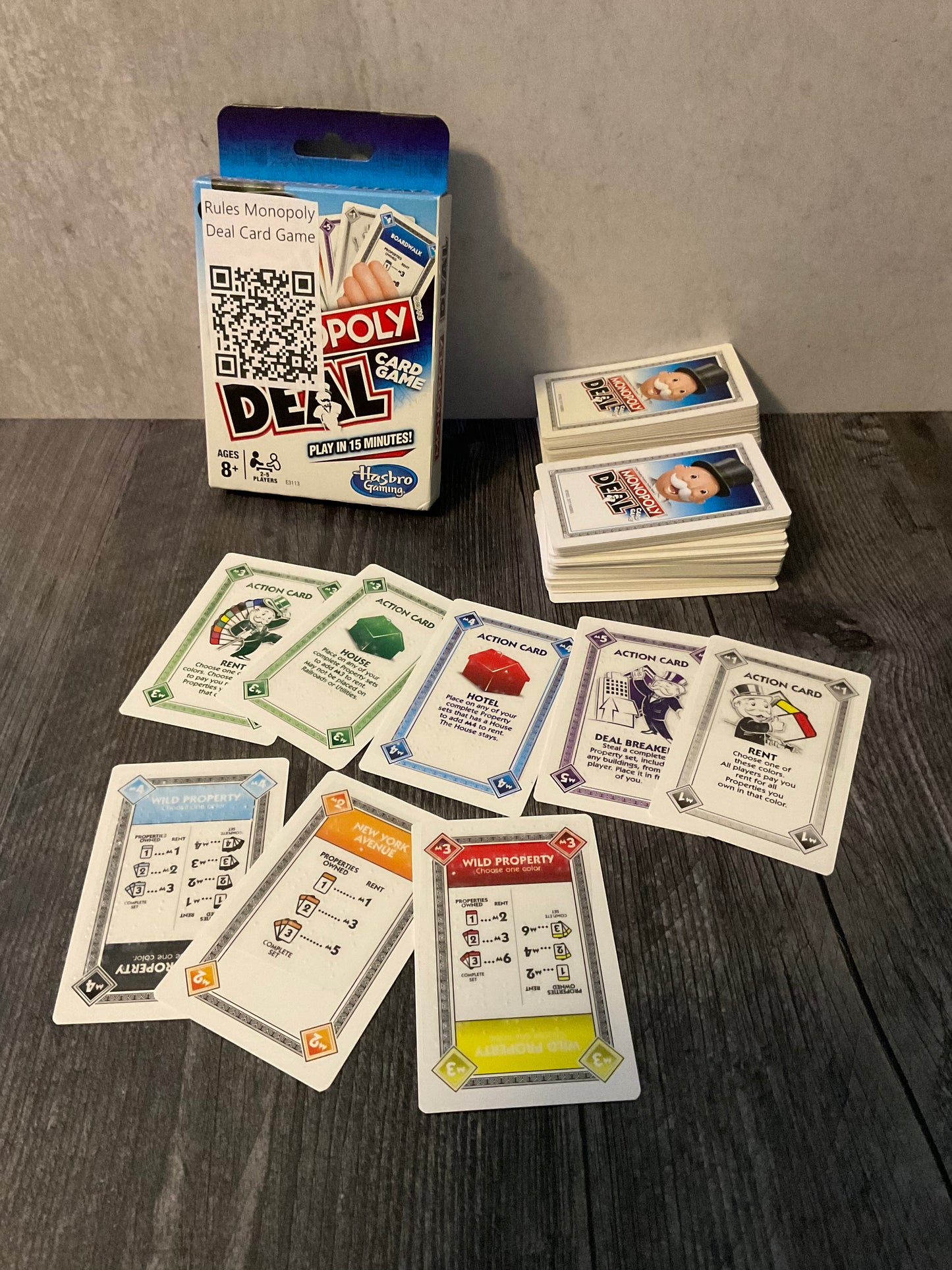 Monopoly Deal game with braille on it. All the types of cards are shown.
