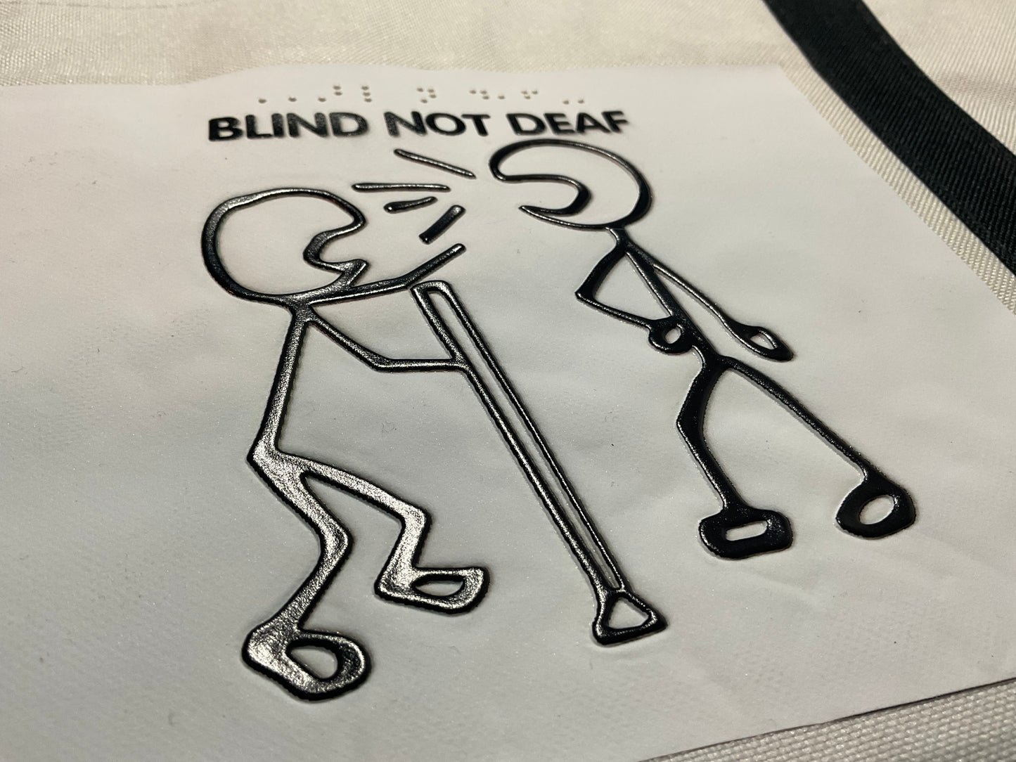 Tactile tote bag with "Blind not Deaf" written on it