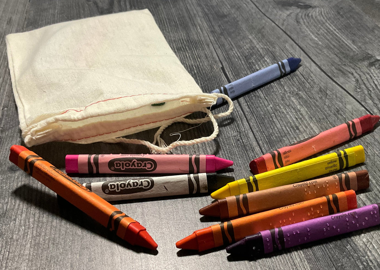 Braille crayons with cloth storage bag.