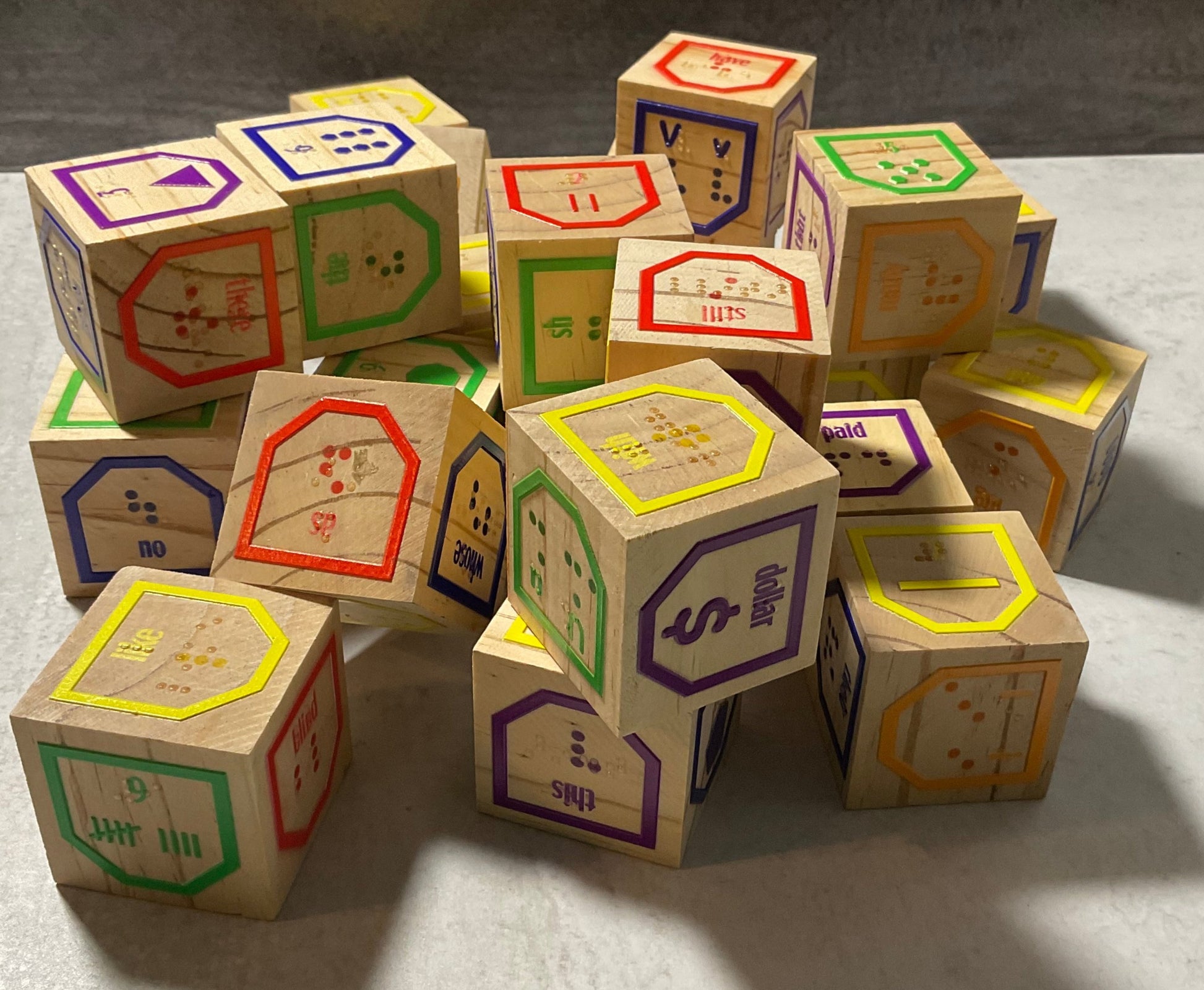 The alphabet blocks stacked on top of each other.