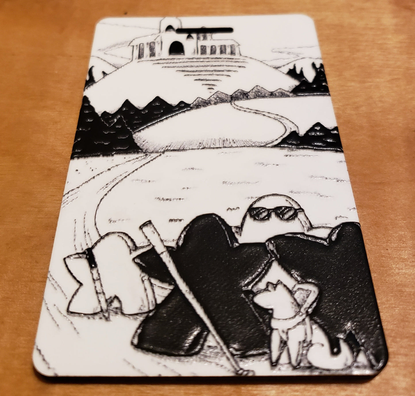 A textured picture on a luggage tag drawn by the blind Artist Razz