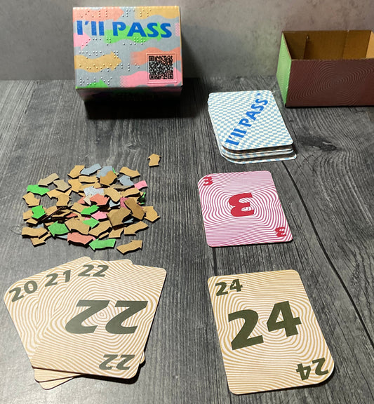 A picture of the game with the cardboard tokens laid out and some of the cards presented in front.
