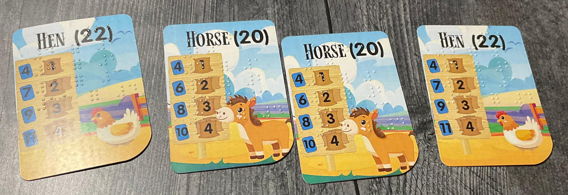 close up of the braille/large print cards on a wooden surface