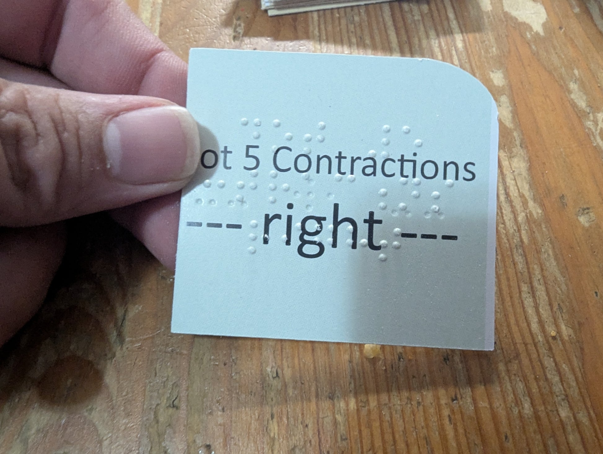 A picture highlighting dot 5 contractions. Braille is on 1 side saying "Dot 5 contractions - right) and the opposite side has dot 5 r with a lead in and a lead out.